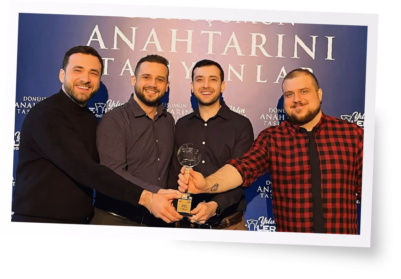 The Pax Animi Games team holding an award